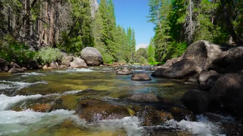 Slow Motion Of River Flowing Over Rocks In Yosemite National Park Stock Footage 302599175