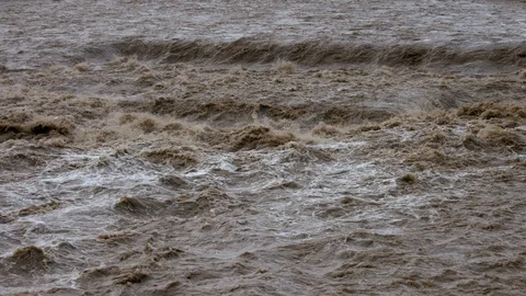 Slow motion - River swollen by heavy rain Stock Footage 88987857
