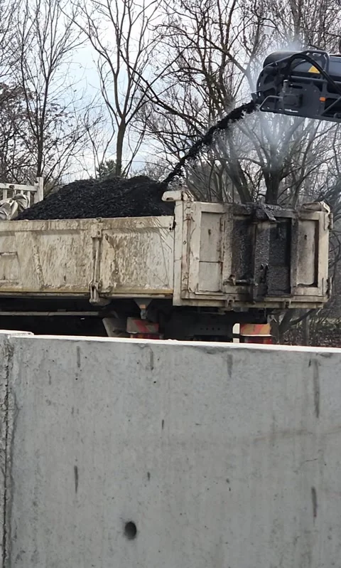 Slow motion of road pavement milling machine and truck Stock Footage 343755754