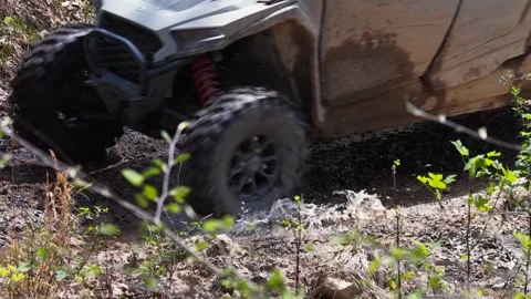 Slow motion off-road vehicle through puddle Stock Footage 344999391