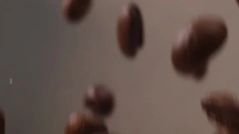 Slow motion of roasted coffee beans fall Video stock 147664293