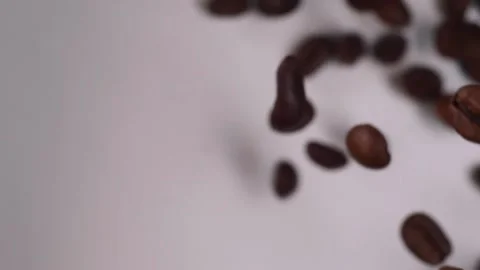 Slow motion of roasted coffee beans fall Video stock 147664434