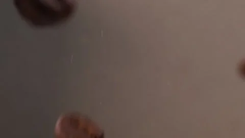 Slow motion of roasted coffee beans fall Video stock 147664471