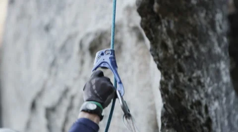Slow Motion Rock Climber Going Down A Cliff Stock Footage 64307528