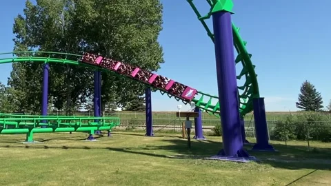 A slow motion of a roller coaster ride with twisty turn Stock Footage 204880915