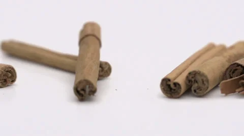 Slow motion rolling cinnamon Stock Footage 33801359