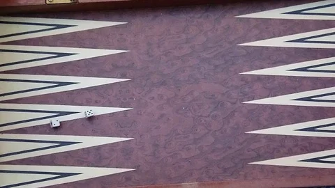 Slow Motion Rolling Dice on Backgammon Board, From Above Stock Footage 98219056