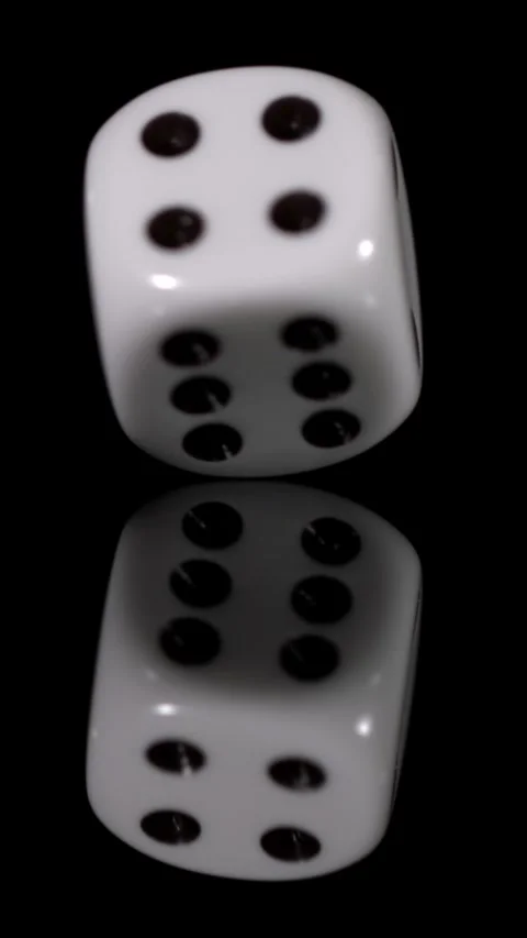 Slow motion of a rolling die showing details of movement and reflection Stock Footage 343289883