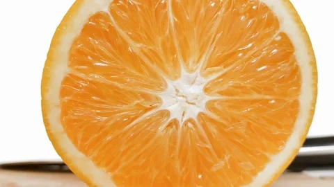 Slow motion. Rolling half citrus on white  background Stock Footage 115115053