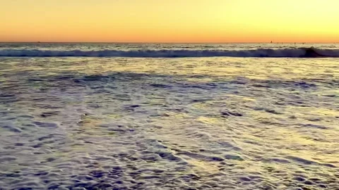 Slow motion of rolling ocean waves at sunset Stock Footage 339512216