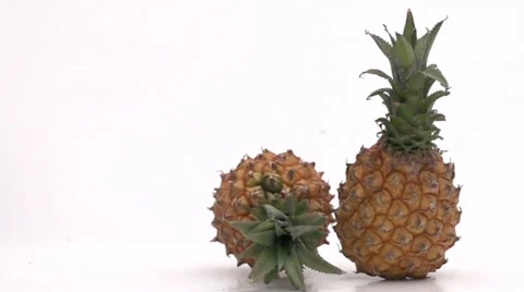 Slow motion rolling pineapple Stock Footage 33801858