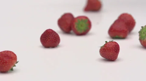 Slow motion rolling strawberries Stock Footage 33802164