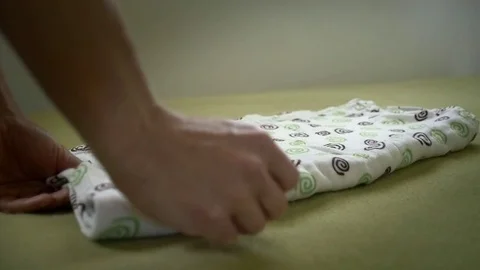 Slow motion of rolling up towel Stock Footage 76792280