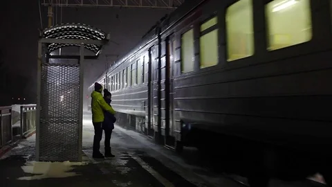 Slow Motion. Romantic couple talking at a train station. Stock Footage 78001831