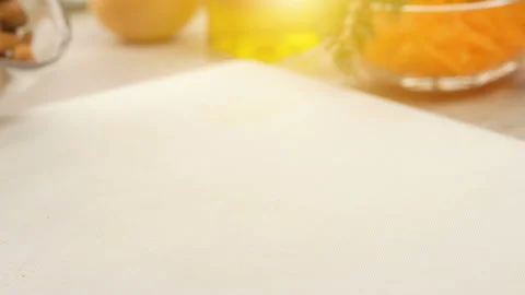 Slow motion of rosted almonds falling on white kitchen board Stock Footage 88540790