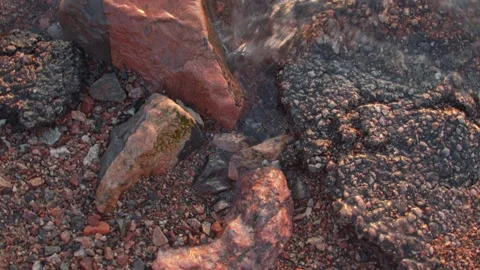 Slow motion rotating water lapping at rocks in Helsinki, Finland Stock Footage 146263506