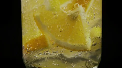 Slow motion. Rotation of bubbles in a bottle of lemonade Stock Footage 76156556