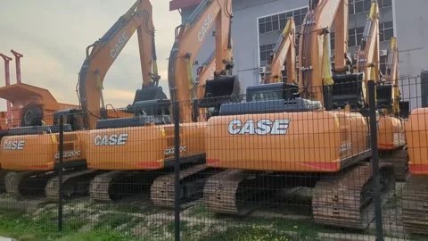 Slow Motion Row of CASE Hydraulic Excavators in Construction Yard Video stock 328973462