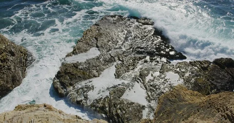 Slow motion of the rugged coastline from the bluffs at Montana de Oro State Stock Footage 99146163