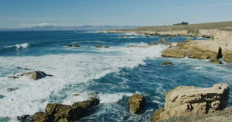 Slow motion of the rugged coastline from the bluffs at Montana de Oro State Stock Footage 99146297