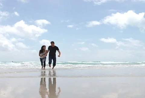 Slow motion running on the beach Stock Footage 1065619