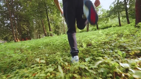 Slow motion of running legs, close-up of running legs Stock Footage 247548738