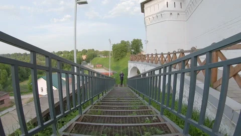Slow motion running on the stairs. Stock Footage 135985390