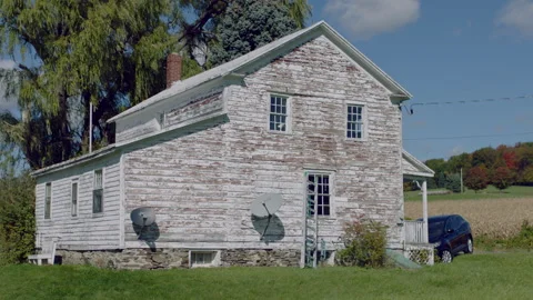 Slow Motion Rustic House in a Lush Rural Autumn Landscape Stock Footage 146882453