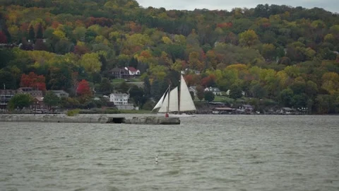 Slow Motion Sailboat passing by on Seneca Lake New York in Watkins Glen Stock Footage 218408070