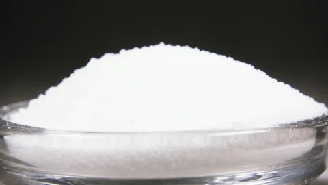 Slow motion salt mix with a spoon into a glass bowl close up Video stock 95783019