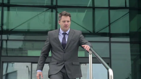 Slow Motion Of Satisfied Businessman Sliding Down The Rail And Falling. Stock Footage