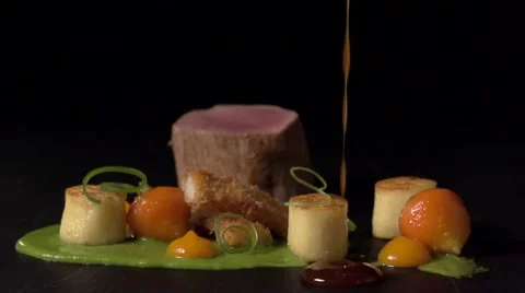 Slow motion sauce sweating on fine dining dish Stock Footage 68963387