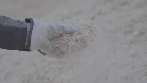 Slow Motion of Sawdust Falling from Hand, 120 FPS - S-Log Stock Footage 318322087