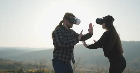 Slow motion scene video of couple using VR device which are fun virtual computer Stock Footage 310380372