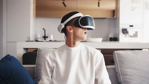 Slow motion scene video of young caucasian man using VR device fun virtual Stock Footage 138903559