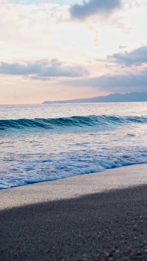 Slow Motion Scenic Sunset Over the Ocean Promenade with Soft Clouds Stock Footage 303598229