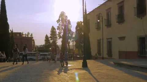 Slow motion of school aged children and families walking in a plaza in Mexico Stock Footage 63650825