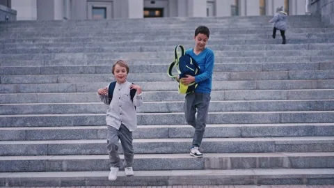 Slow motion of school kids getting down from staircase at school 4k. Stock Footage 161248934