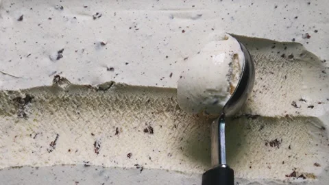 Slow-Motion scoop cookie and cream ice cream with blue spoon. Stock Footage 170819176