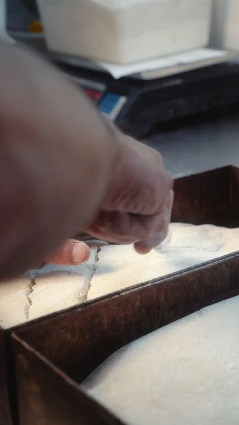 Slow Motion Scoring Bread Dough in Metal Baking Tray with Blade Video stock 345040311