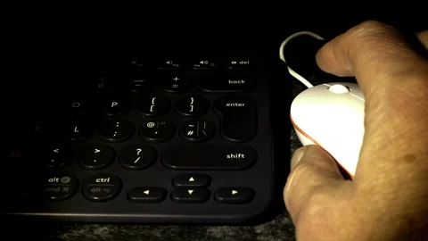Slow motion - Scrolling computer mouse then pressing enter key on keyboard. 動画素材 99353012