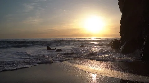 Slow motion: sea rippling and hitting at sunset. Video stock 105426853