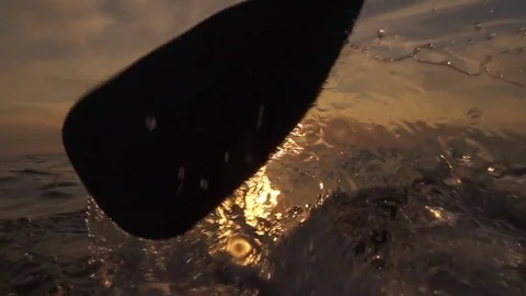 SLOW MOTION: Sea splashing into camera when pushing paddle blade through water 스톡 동영상 69182629