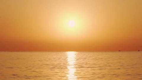 Slow motion of the sea surface with small waves of the sunrise of the sun Stock Footage 100088661