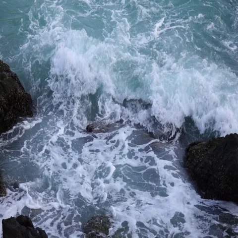 Slow motion of sea swash between rocks. Stock Footage 69359368