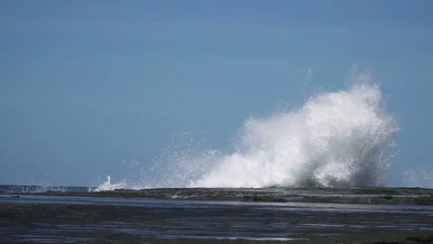 Slow motion sea wave hit rock at coast with big splash Stock Footage 86773702