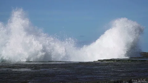 Slow motion sea wave hit rock at coast with big splash Stock Footage 86774475