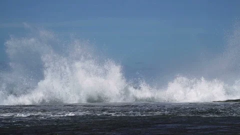 Slow motion sea wave hit rock at coast with big splash Stock Footage 86774572
