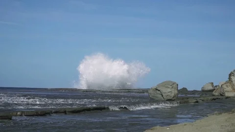 Slow motion sea wave hit rock at coast with big splash Stock Footage 86797012