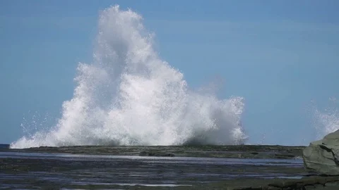 Slow motion sea wave hit rock at coast with big splash Stock Footage 86798153